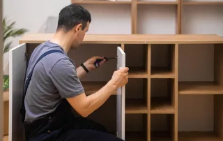 man-assembling-cabinet